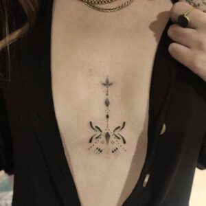 Between the Breast Tattoo Ideas With Meaning